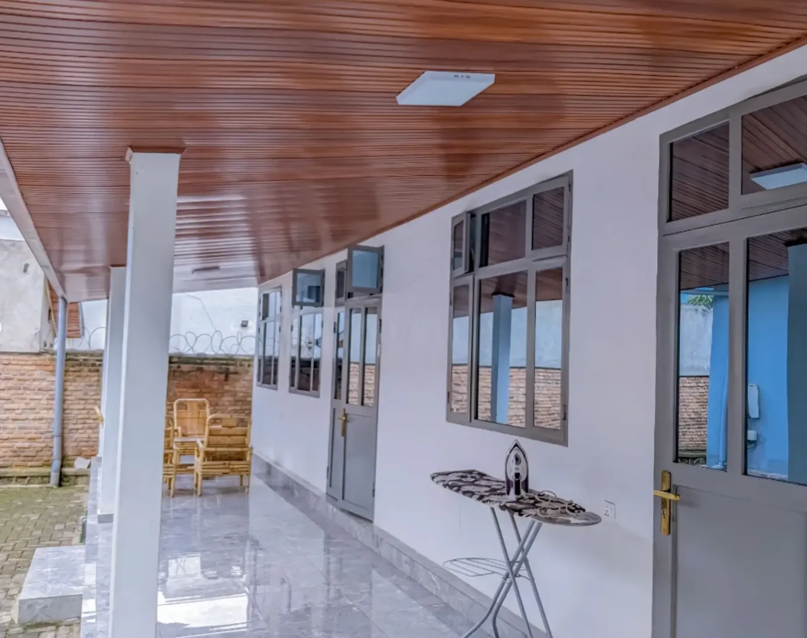 The covered walkway along the house