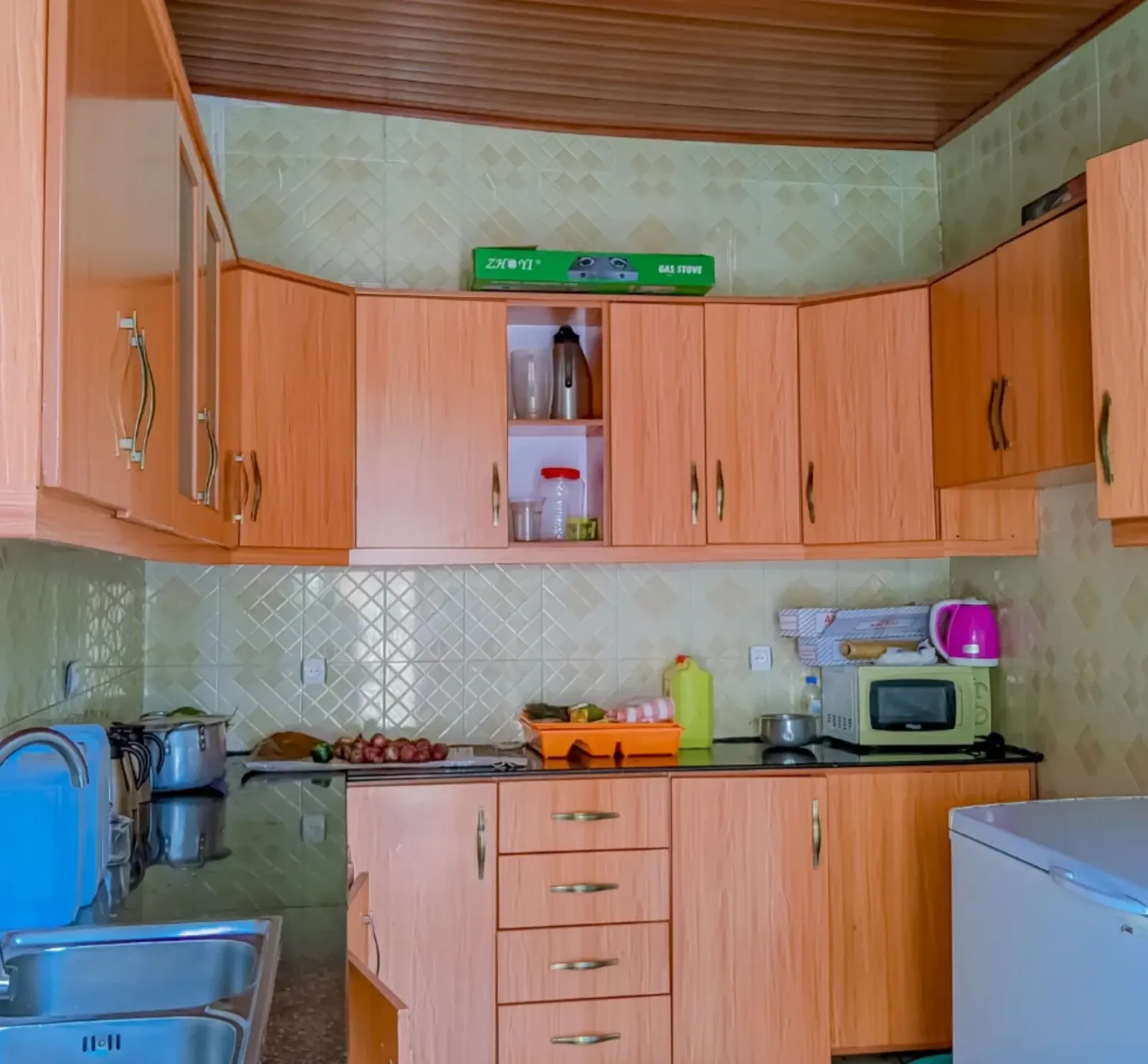 The fitted kitchen, with fridge and microwave